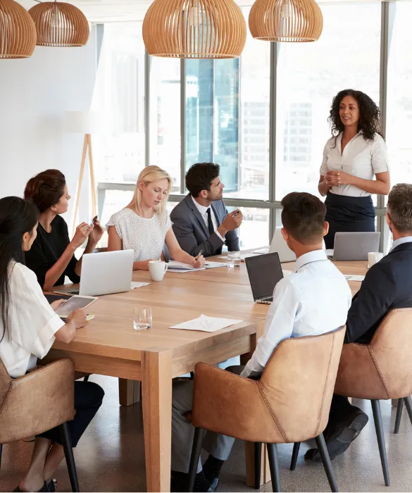Business meeting with diverse team members discussing strategy in a modern office