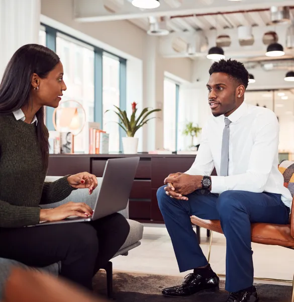 Businesswoman conducting an interview with a candidate at Moving Heads Recruitment Agency